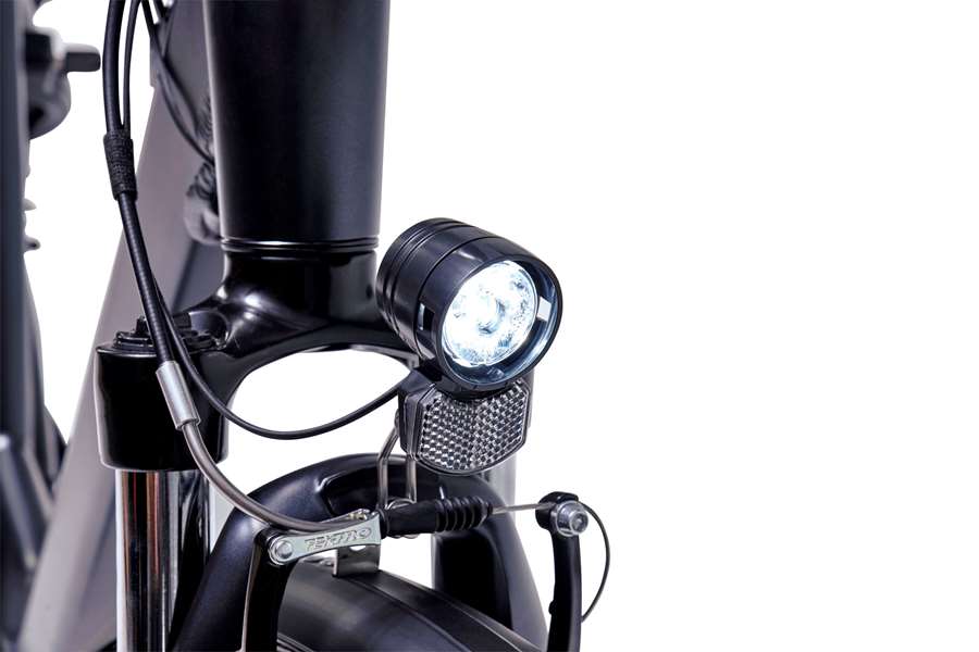 A product image of the Veloci Spirit electric bike from LeaseBike showing the detail of the integrated front white light, which is powered by the electric bike's battery.
