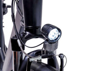 Load image into Gallery viewer, A product image of the Veloci Spirit electric bike from LeaseBike showing the detail of the integrated front white light, which is powered by the electric bike&#39;s battery.
